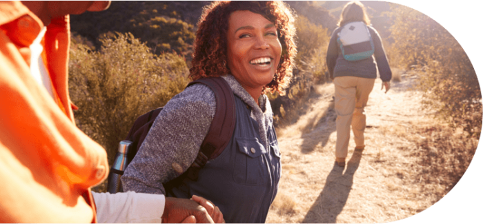 young woman, smiling and hiking