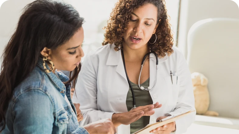 female nurse speaking with patient