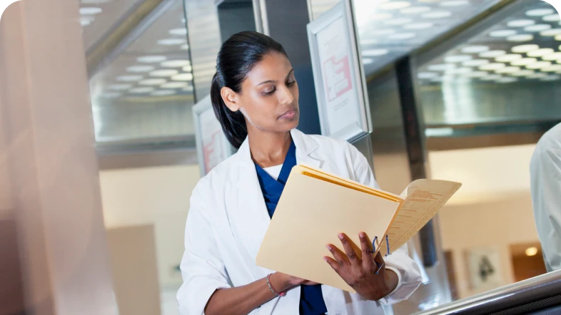 female doctor looking at documents