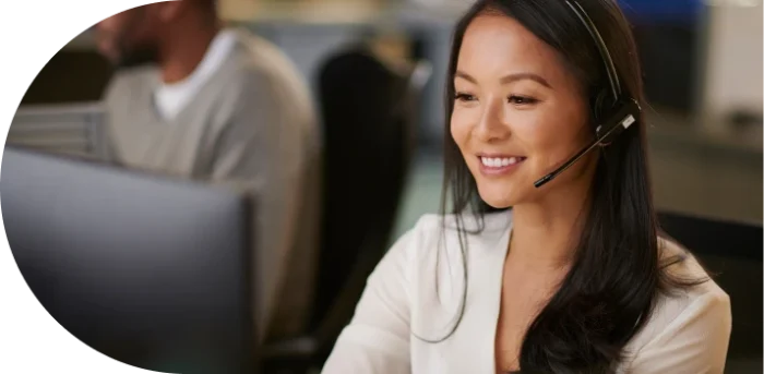 female smiling and wearing a headset