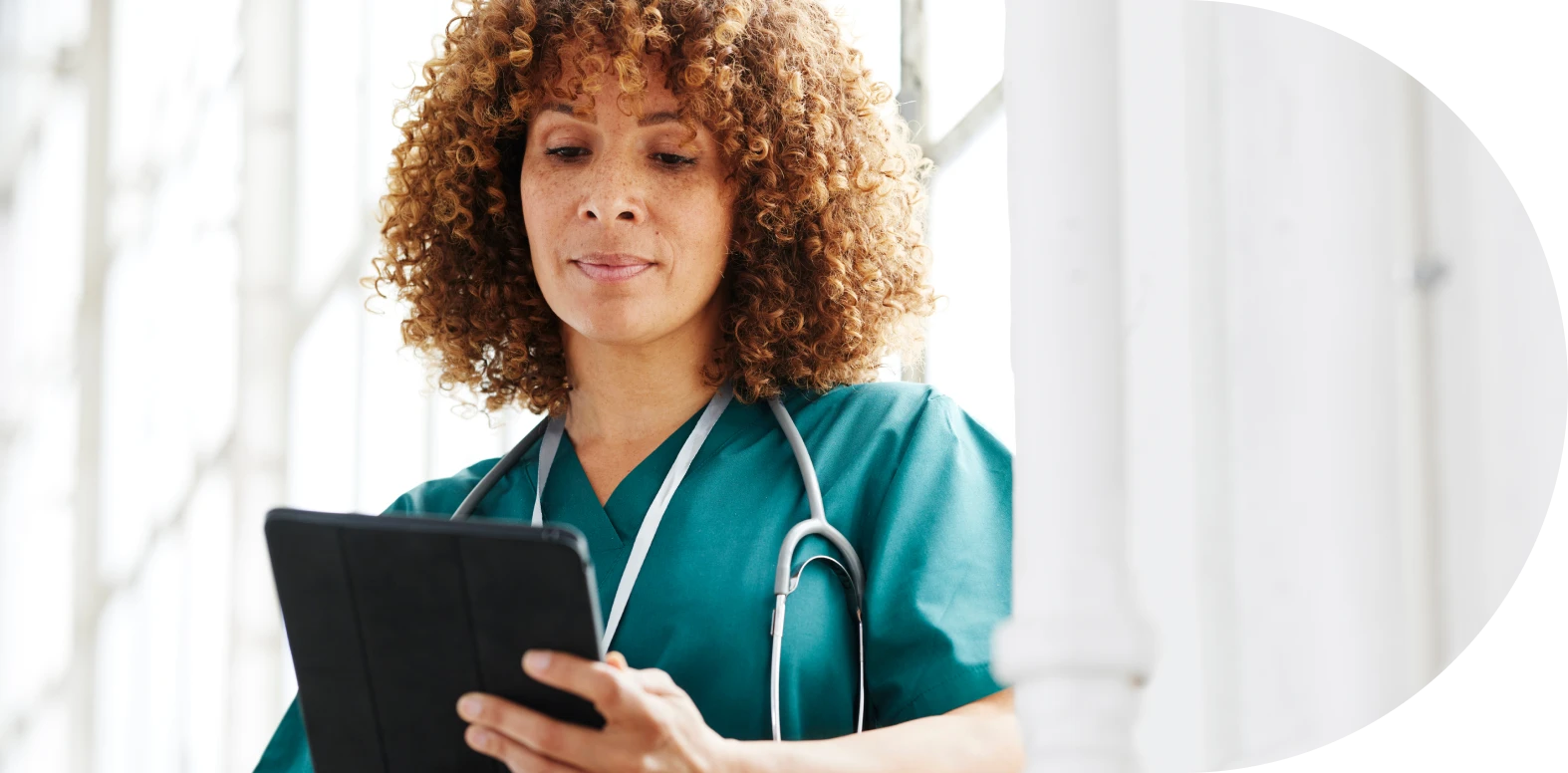 female nurse holding tablet